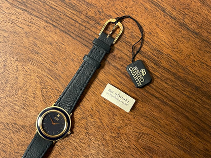 (1983) Seiko 7320-010A dress watch - purple bezel - dark blue dial w/gold markers - small size (NOS)