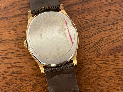 (1970s) Tissot 41141 "Ellipse" dress watch - gold case - silver brushed dial w/ gold stick markers (NOS)