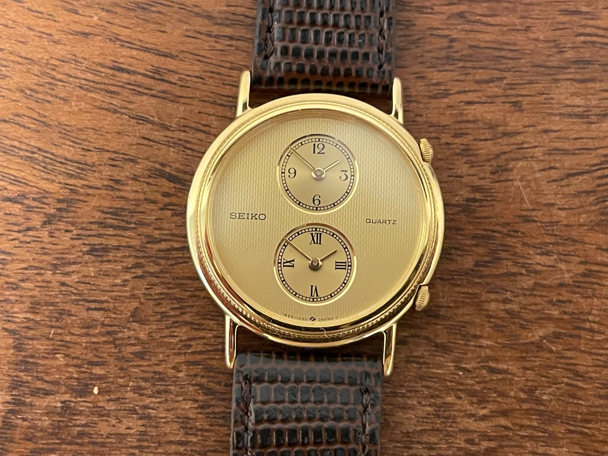 (1985) Seiko 1E20-0160 dual time dress watch - round case - gold textured dial w/ 2 subdials