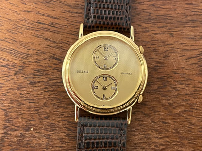 (1985) Seiko 1E20-0160 dual time dress watch - round case - gold textured dial w/ 2 subdials