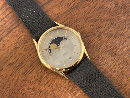 (1986) Seiko 7434-7000 dress watch with moon phase -silver dial w/ gold stick markers (NOS)