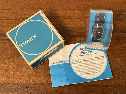 (1970s) Timex 519-105 dress watch - elongated oval case - black cross dial - small size (NOS + full set)