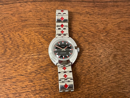 (1970s) Timex 509-528 dress watch - silver case - black dial w/ silver & red markers - small size (NOS + full set)