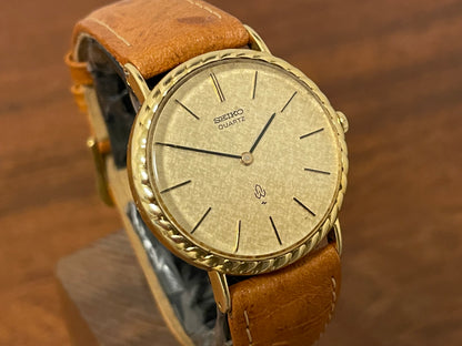 (1977) Seiko 43-0150 14K solid gold dress watch - rope bezel -  gold textured dial w/ gold markers