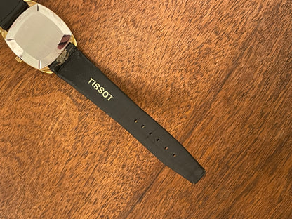 (1970s) Tissot Stylist dress watch - gold case - black dial w/ gold Roman numerals (NOS)