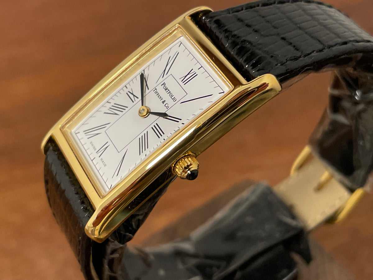 (1998) Tiffany & Co. Portfolio "Tank" dress watch - gold case - white dial w/ black Roman numerals (Mint)