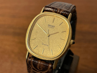 (1981) Seiko 6030-5410 Dolce "Ellipse" - gold plated case w/ etched bezel - gold textured dial w/ gold markers