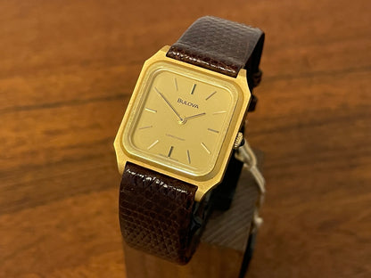 front side of a 1982 Bulova Longchamp "Tank" dress watch - gold case w/ champagne dial 