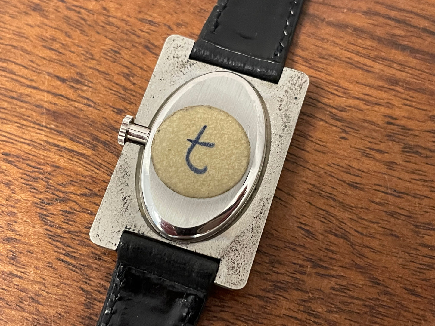 (1970s) Tissot Stylist "Tank" - decorated case - black sunburst dial w/ white Roman numerals - small size (NOS)