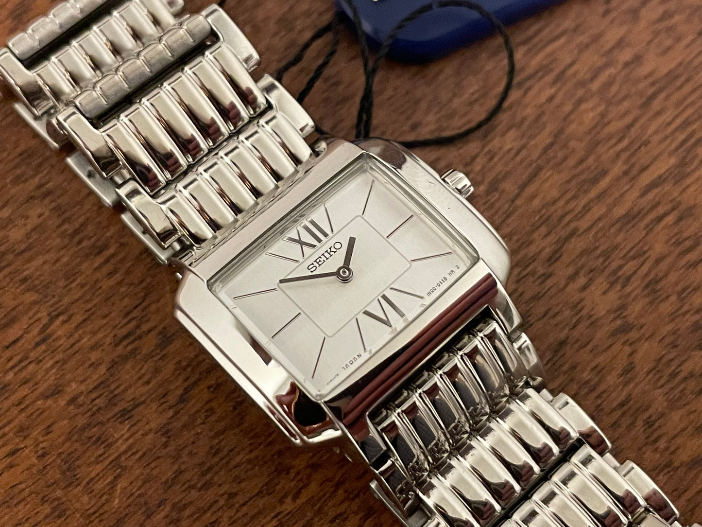 (1998) Seiko 1N00-0PT0 - rectangular case - silver dial w/ silver Roman numerals & markers - small size (NOS)