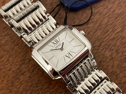 (1998) Seiko 1N00-0PT0 - rectangular case - silver dial w/ silver Roman numerals & markers - small size (NOS)