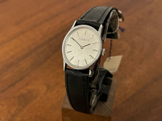 Front side (1970s) Tissot 052-10991 Stylist dress watch - silver oval case - silverdust dial w/ silver stick markers - small size (NOS)