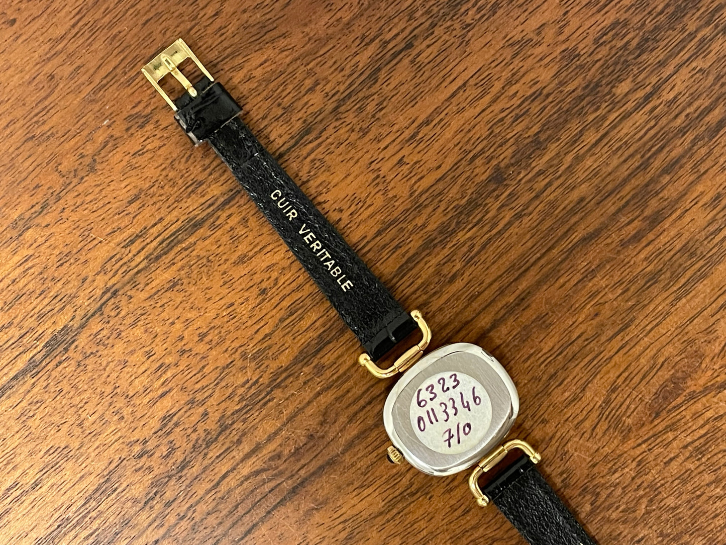 (1980s/1990s) Bulova Paris dress watch - cushion case - gold dial w/ black Roman numerals - small size (NOS)