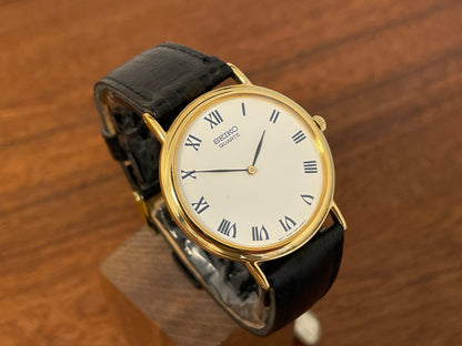 (1991) Seiko 7N00-8A00 dress watch - white dial w/ Roman numerals & Leafe hands (NOS)