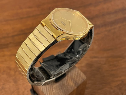 (1983) Seiko 8420-0140 dress watch - gold case - gold sunburst dial w/ gold stick markers (NOS)