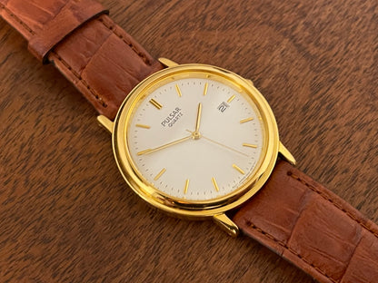 (2003) Pulsar V532-8B40 dress watch - gold colored case - white dial w/ gold markers (NOS)