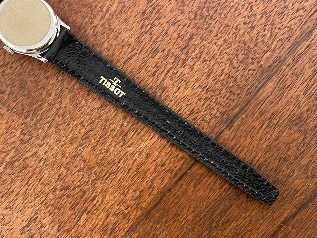 (1970s) Tissot 052-10991 Stylist dress watch - silver oval case - silverdust dial w/ silver stick markers - small size (NOS)