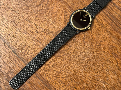 (1993) Seiko 6530-5120 dress watch- oval black case w/ gold bezel en hands (NOS)