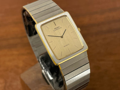 (1983) Seiko 6730-565H Lassale ultra thin - stainless steel bracelet - brushed gold dial w/ black stick markers (NOS)
