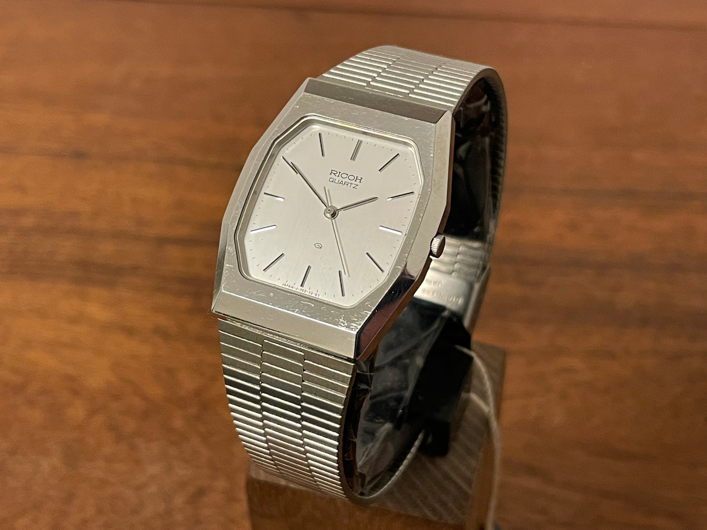 Front side (1977) Ricoh 702008SS dress watch - silver brushed dial w/ silver markers (NOS)