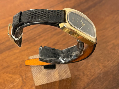(1979) Timex 100 manual wind dress watch - Swiss made - tonneau case - black dial w/ gold markers