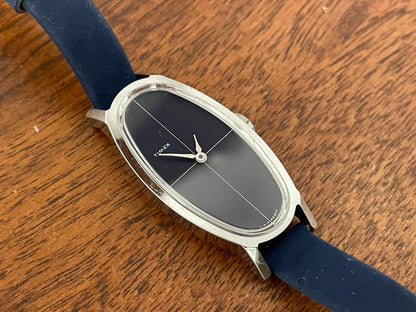 (1970s) Timex 519-105 dress watch - elongated oval case - black cross dial - small size (NOS + full set)