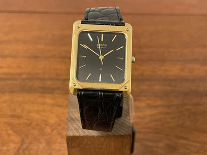 (1977) Ricoh 702009 quartz "Tank" dress watch - black dial w/ gold markers (NOS)