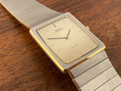 (1983) Seiko 6730-565H Lassale ultra thin - stainless steel bracelet - brushed gold dial w/ black stick markers (NOS)