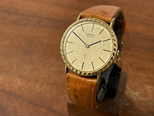 (1977) Seiko 43-0150 14K solid gold dress watch - rope bezel -  gold textured dial w/ gold markers