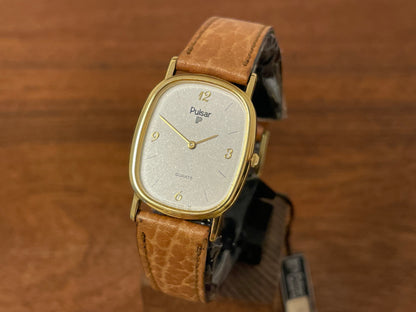 Front side (1985) Pulsar V320-5029 "Ellipse" dress watch - gold case - diamond dust dial (NOS)