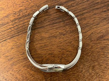 (2000) Seiko 2E20-753A Rivoli - asymmetrical silver case - blue dial w/ dot markers - small size