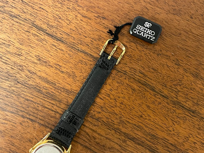 (1986) Seiko 2A24-0040 dress watch - white dial w/ moonphase & Roman numerals - small size (NOS)