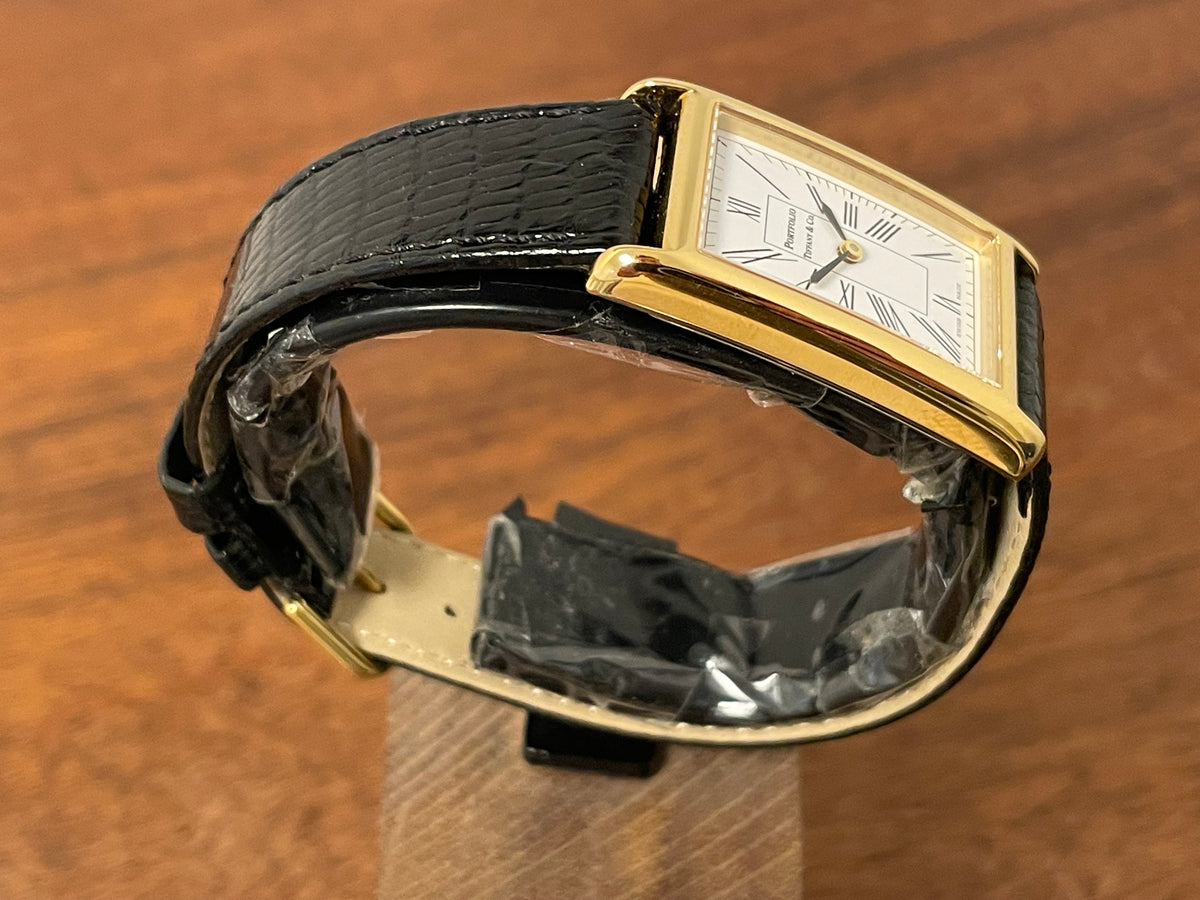 (1998) Tiffany & Co. Portfolio "Tank" dress watch - gold case - white dial w/ black Roman numerals (Mint)