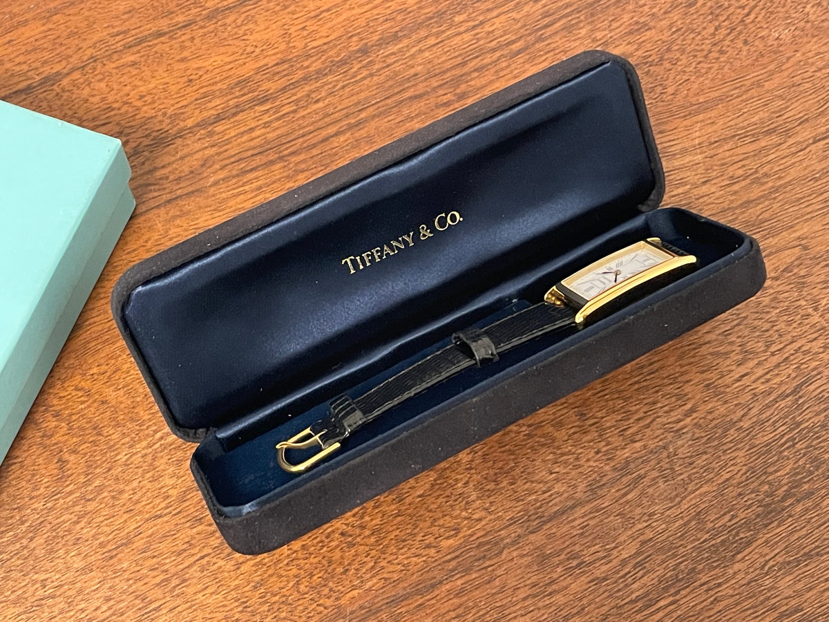 (1998) Tiffany & Co. Portfolio "Tank" dress watch - gold case - white dial w/ black Roman numerals (Mint)