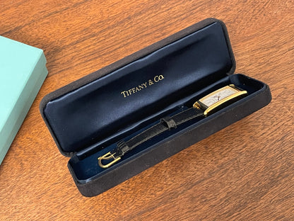 (1998) Tiffany & Co. Portfolio "Tank" dress watch - gold case - white dial w/ black Roman numerals (Mint)