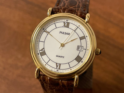 (2000) Pulsar V532-8A60 dress watch - gold colored case - white dial w/ black Roman numerals (NOS)