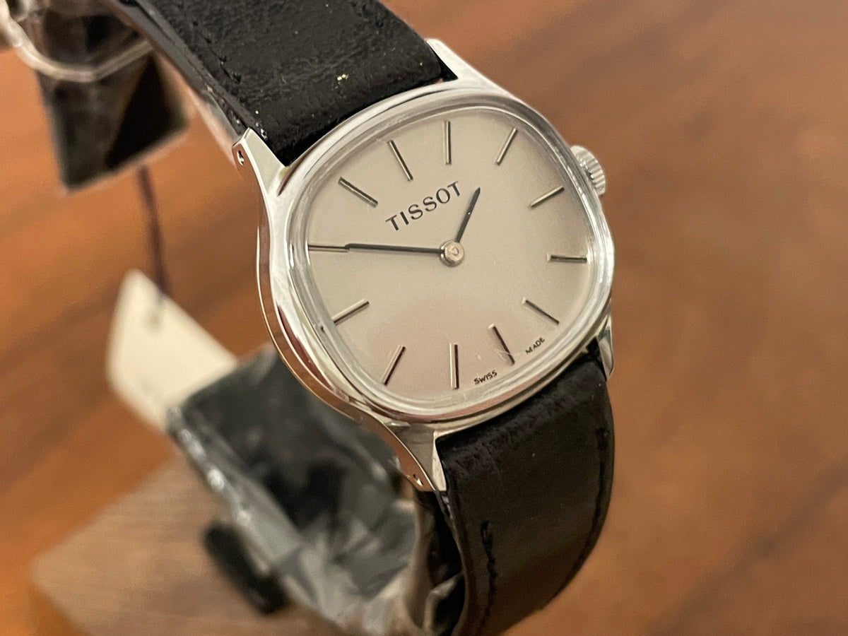 (1970s) Tissot 052-15007 Stylist dress watch - silver cushion case - silver brushed dial w/ silver stick markers - small size (NOS)