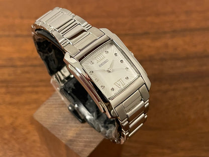 (1999) Seiko 7N01-0FW0  - "Tank" style case - silver dial w/ silver Roman numerals - small size (NOS)