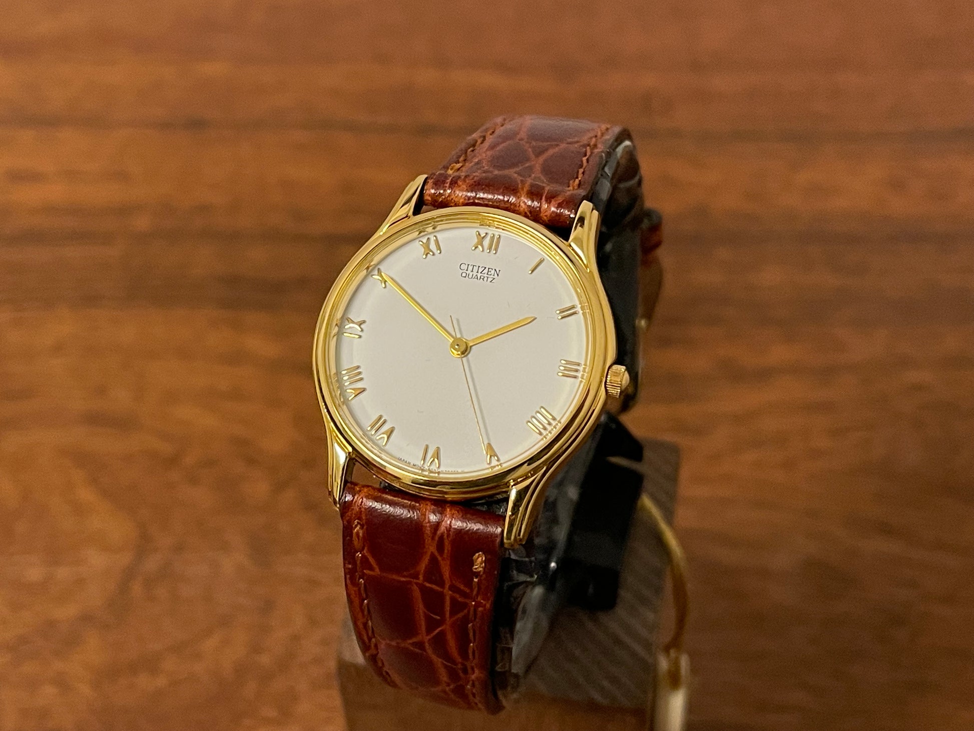 Front side (1981) Citizen 6031-S38419 dress watch - white dial w/ gold Roman numerals - small size (NOS)