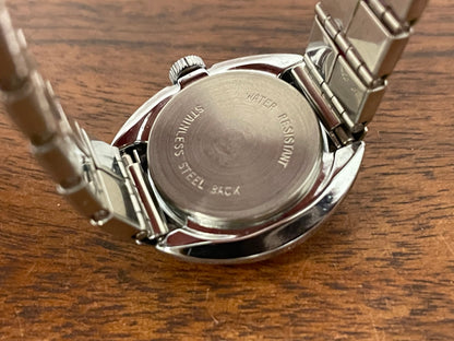 (1970s) Timex 509-528 dress watch - silver case - black dial w/ silver & red markers - small size (NOS + full set)