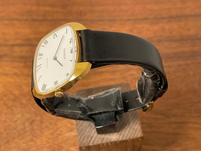(1970s) Tissot Stylist dress watch - gold “tv case” - white dial w/ black Roman numerals (NOS)