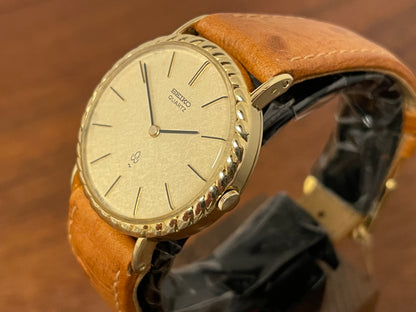 (1977) Seiko 43-0150 14K solid gold dress watch - rope bezel -  gold textured dial w/ gold markers