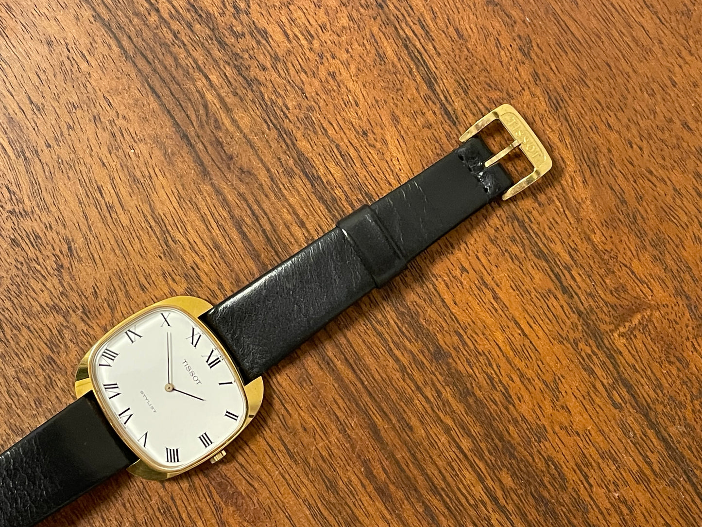(1970s) Tissot Stylist dress watch - gold “tv case” - white dial w/ black Roman numerals (NOS)