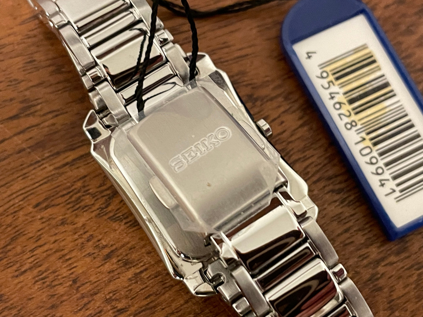 (1999) Seiko 7N01-0FW0  - "Tank" style case - silver dial w/ silver Roman numerals - small size (NOS)