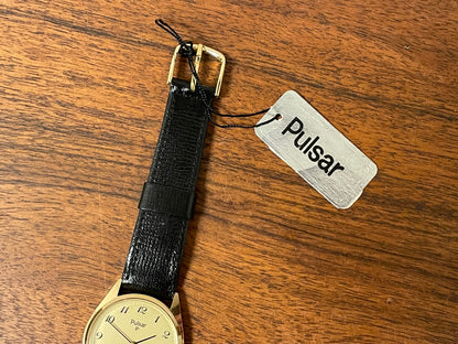 (1991) Pulsar Y480-0460 dress watch - gold colored case - matt champagne dial w/ black Arabic numerals - (NOS)