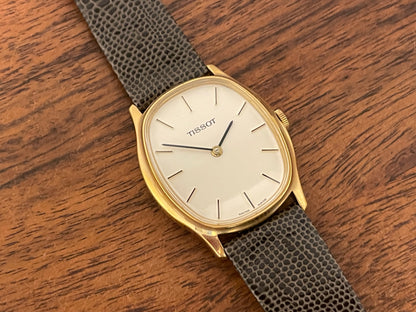 (1970s) Tissot 41141 "Ellipse" dress watch - gold case - silver brushed dial w/ gold stick markers (NOS)