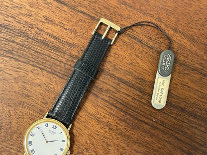 (1991) Seiko 7N00-8A00 dress watch - white dial w/ Roman numerals & Leafe hands (NOS)