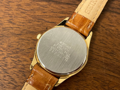 (1993) Seiko 4N00-0591 dress watch - gold bezel w/ black dial and gold markers - small size (NOS)