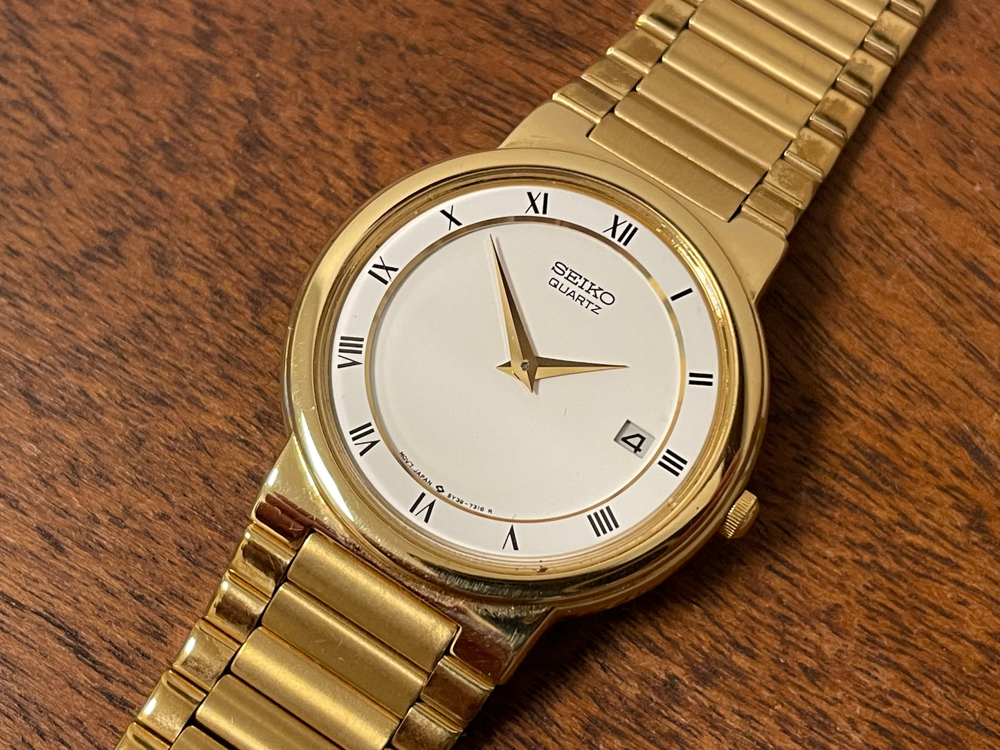 (1992) Seiko 5Y89-7A10 dress watch – white dial w/ Roman numerals & date (NOS)