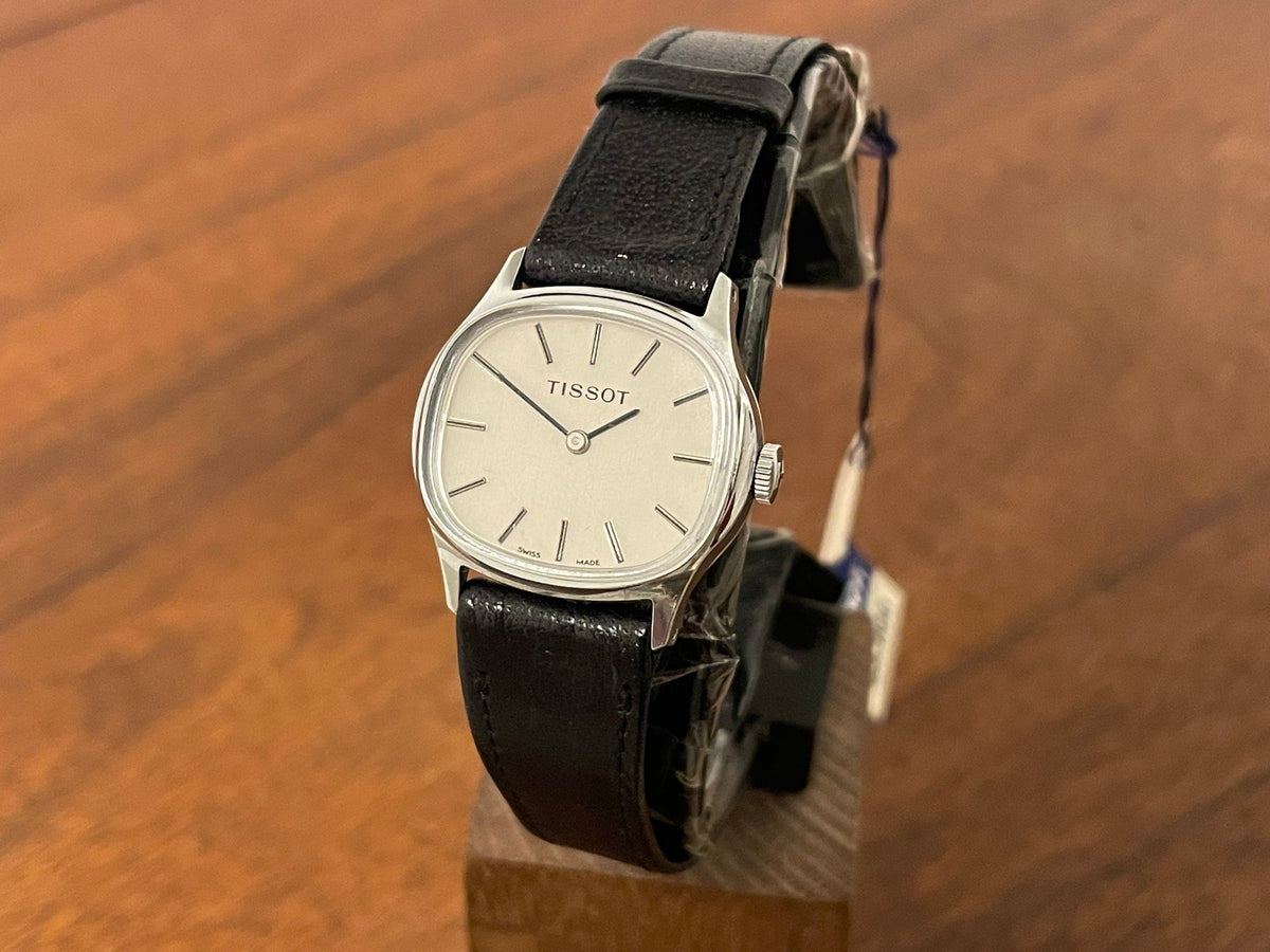 Front side (1970s) Tissot 052-15007 Stylist dress watch - silver cushion case - silver brushed dial w/ silver stick markers - small size (NOS)